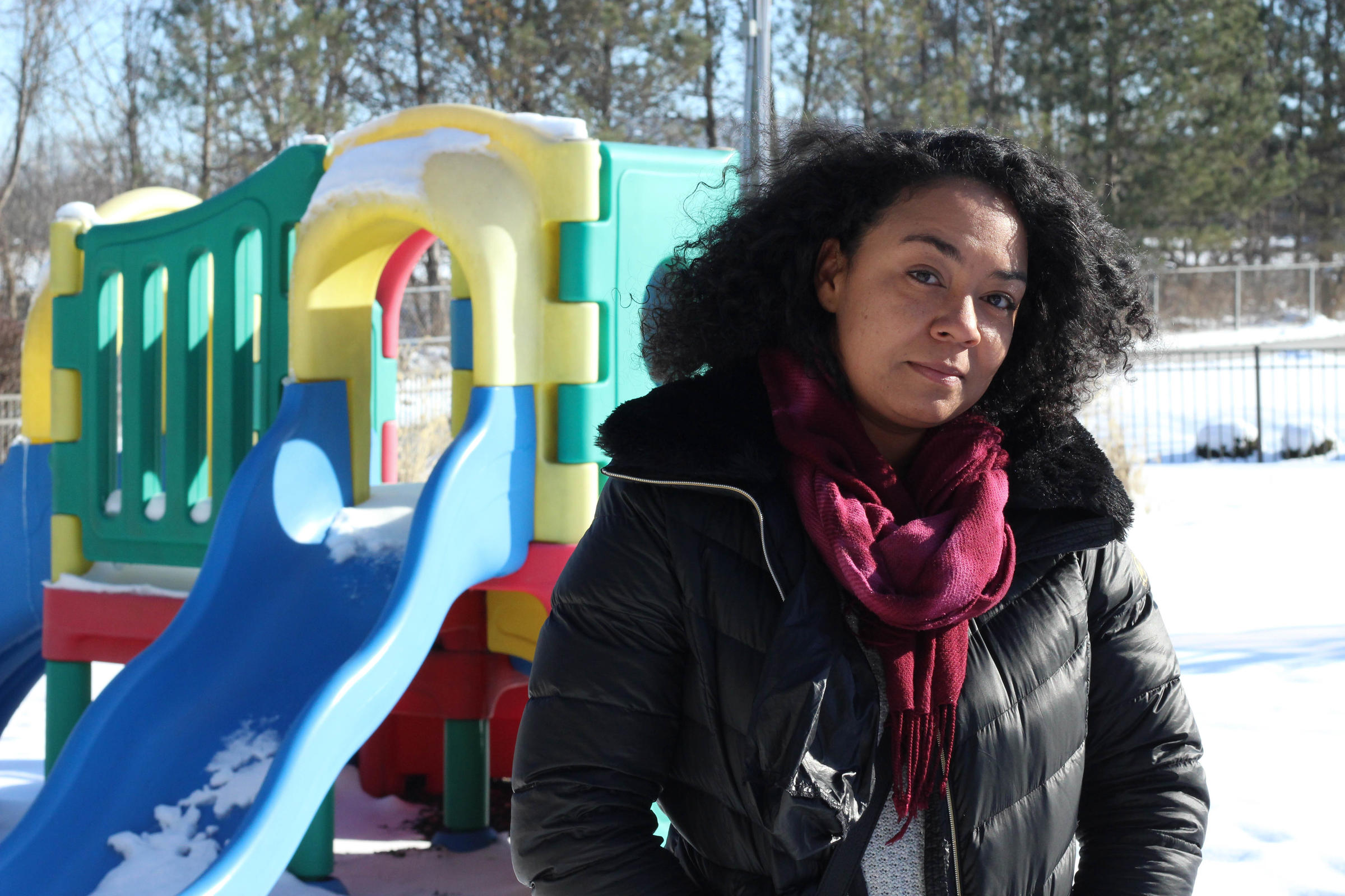 Julia Gilliam stands in front of a play structure.